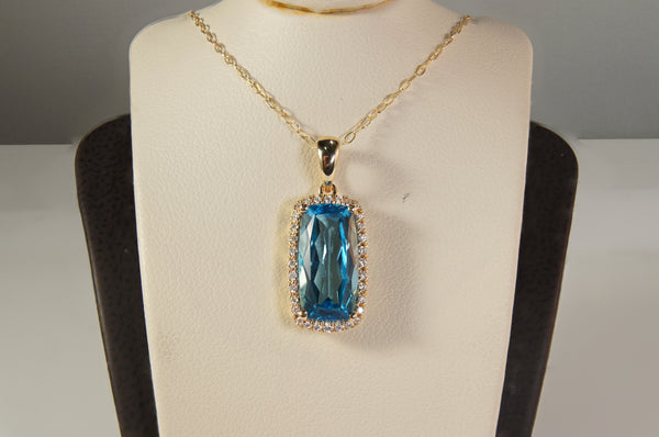 Blue Topaz and Diamond Halo Pendant